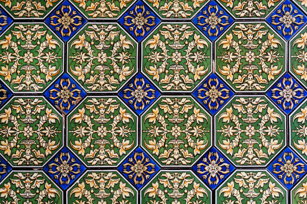 Pattenes on traditional tiles of historical house wall of Andalusia Seville, Spain - November 14: Pattenes on traditional tiles of historical house wall of Andalusia on November 14, 2018. Population of Sevilla is near 750,000 ancient creativity andalusia architecture stock pictures, royalty-free photos & images