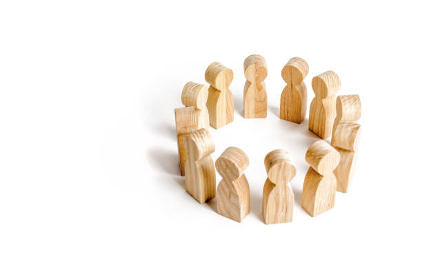 istock People stand in a circle on a white background. Communication. Business team, teamwork, team spirit. Wooden figures of people. A circle of people. discussion and cooperation, coordination cooperation. 1090111866