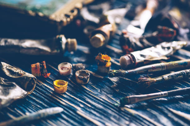 istock Old paint tubes are on the wooden table. 1090116410