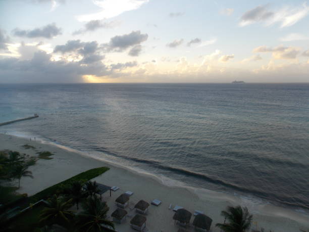 istock Mexico Cozumel Summer Sunset Beach and Rain cloud 1090121514