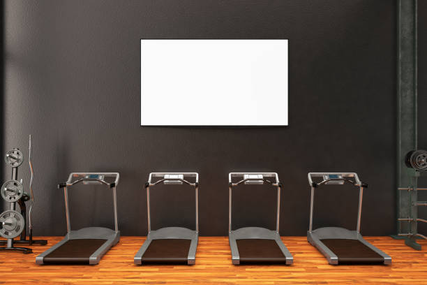 Blank TV Screen Mock up on the Wall in GYM Gym with treadmill and TV Screen exercise room stock pictures, royalty-free photos & images