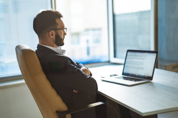 istock The business man working at the table with a laptop 1090124550