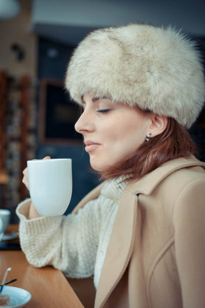 istock Beautiful young woman in cafe 1090131074