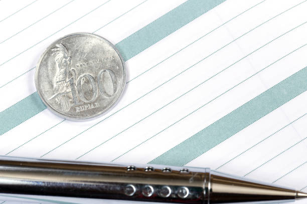 istock Coin one hundred Indonesian rupees on diary 1090131622
