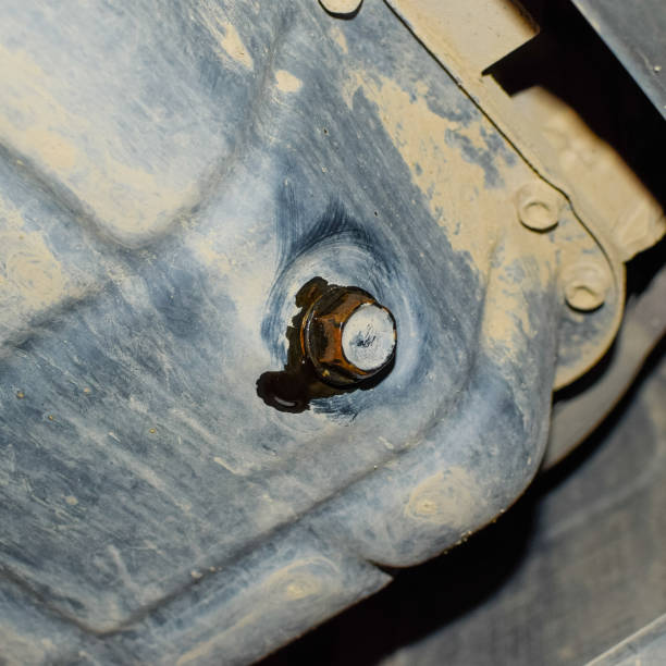 istock Drain the old oil from the engine through the drain plug 1090131684