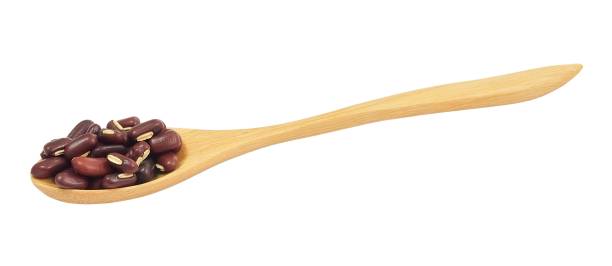 istock Kidney Beans in Wooden Spoon on White Background 1090134584