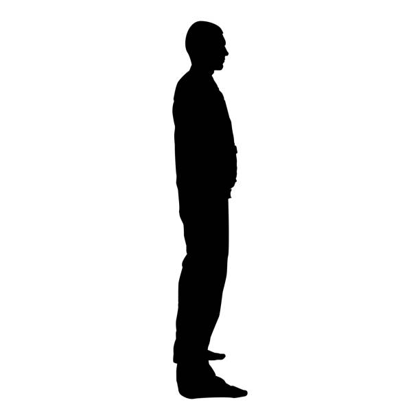 istock Man stands dressed in work clothes overalls and looks straight icon black color vector illustration flat style image 1090136502