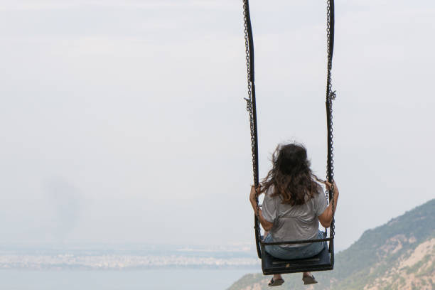 istock Woman on the swing 1090137096