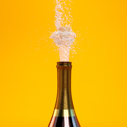 Champagne splash on orange background
