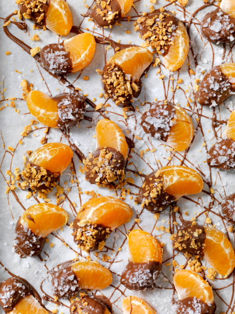 istock Chocolate Dipped Oranges with Roasted Nuts and Flake Salt 1090145108