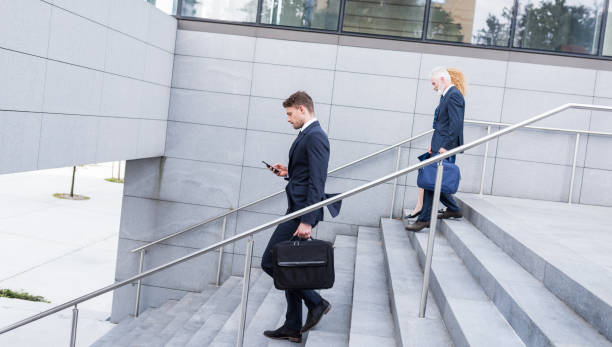 istock Business People Walking Toward Steps Outdoors 1090145198