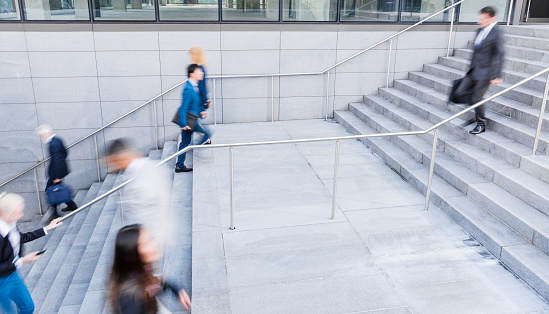 Business People Walking On Stairs Outdoors