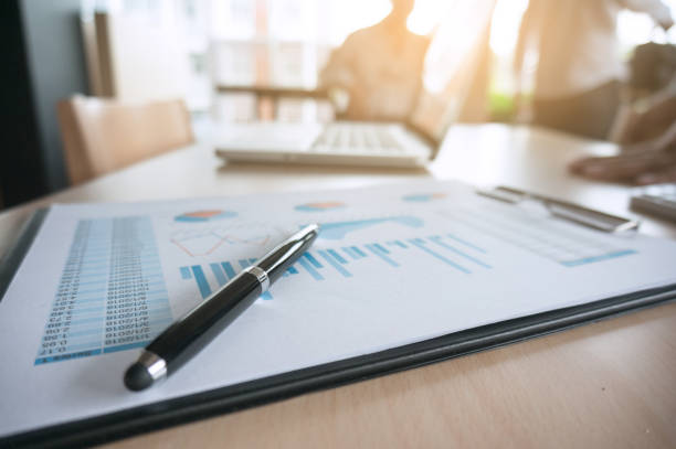 istock Financial graph with a pen on table in office. business concept 1090147204
