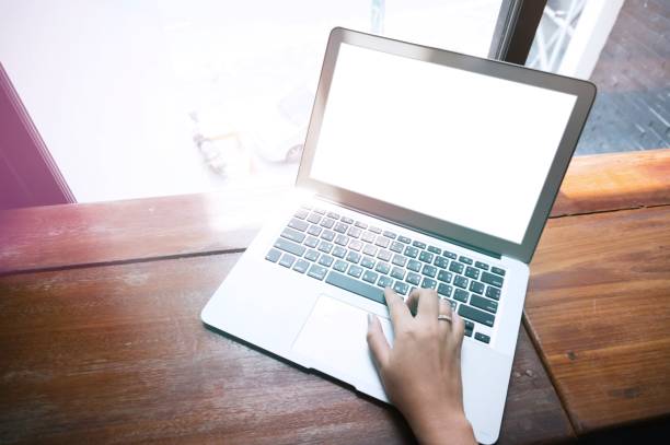 istock Casual business woman working by using a laptop computer on wooden table. Hands typing on a keyboard 1090147292