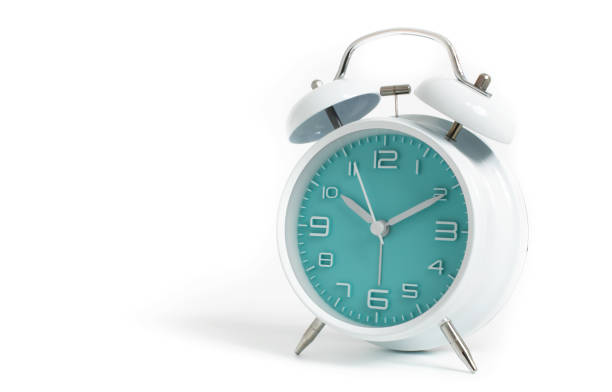 istock Narrow focus to clock with time 10 past 12 or 10.00 AM PM, turquoise clock face, on white background 1090149864
