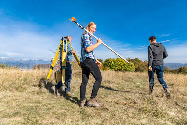 istock Surveyors on Their Way to a Measuring Area 1090149932