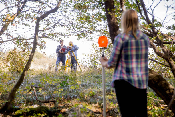 istock Surveyors Measuring in Forest 1090149942