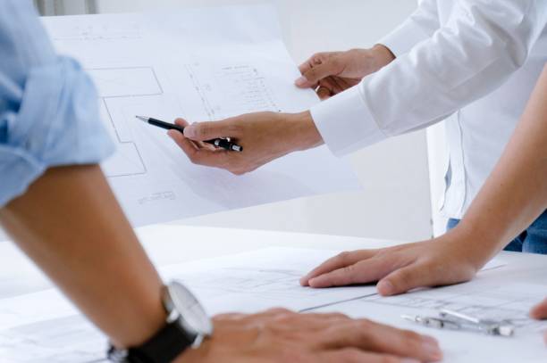 istock Colleagues interior designer Corporate Achievement Planning Design on blueprint Teamwork Concept with compasses. 1090153732