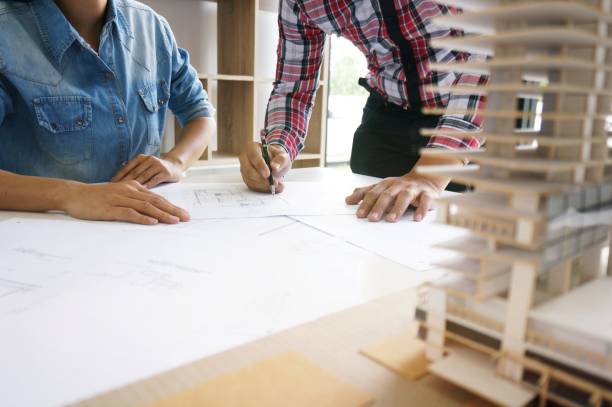 istock Colleagues interior designer Corporate Achievement Planning Design on blueprint Teamwork Concept with compasses 1090153736