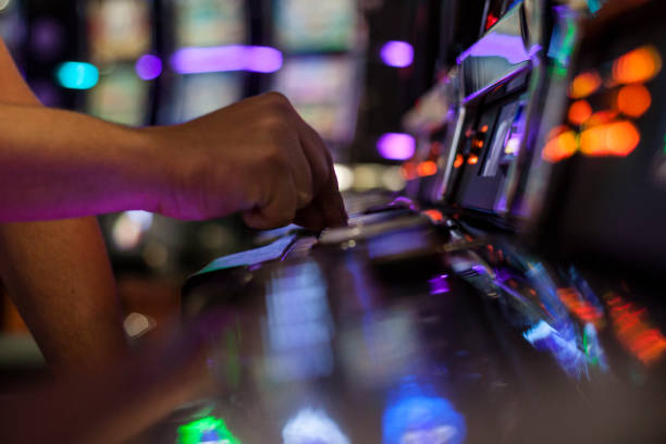 Adult Man Playing on Slot Machine stock photo