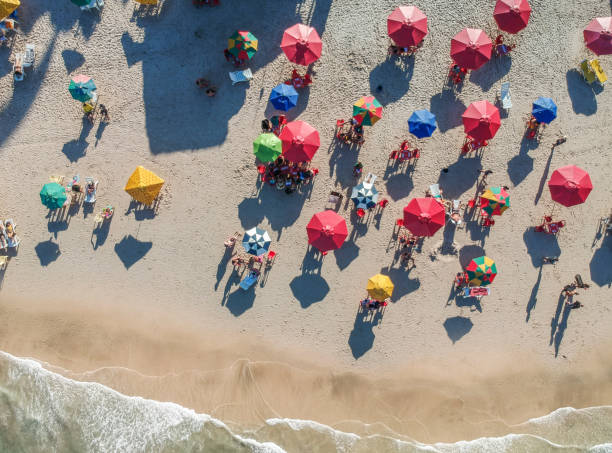 istock People relaxing at the beach, aerial view 1090155438