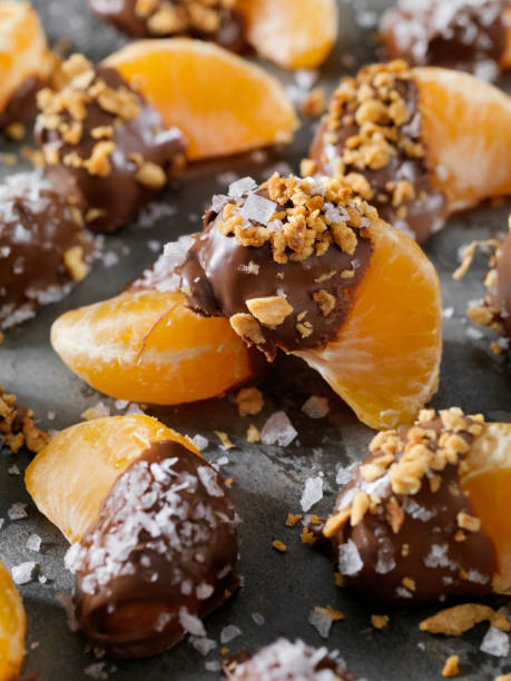 istock Chocolate Dipped Oranges with Roasted Nuts and Flake Salt 1090157888
