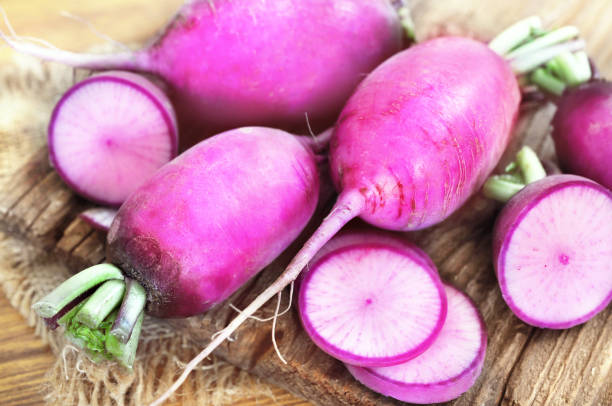 Fresh harvested red daikon radishes Fresh harvested red daikon radishes, selective focus, shallow DOF dikon radish stock pictures, royalty-free photos & images