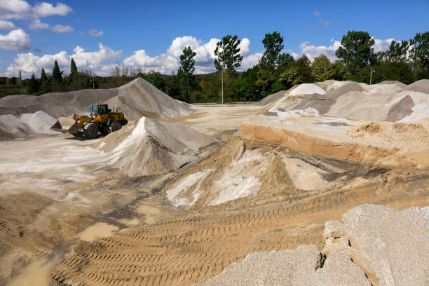 Heavy equipment machine wheel loader on construction jobsite Heavy equipment machine wheel loader on construction jobsite sand mine stock pictures, royalty-free photos & images