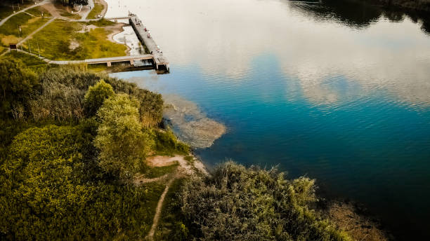 istock Aerial view of lake surrounded by forest 1090164260