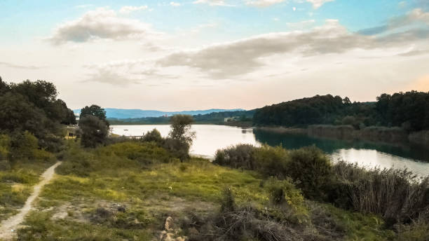 istock Aerial view of lake surrounded by forest 1090164264