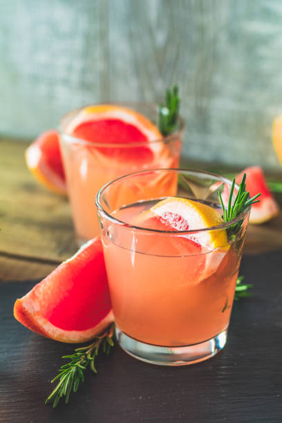 istock Pink cocktail with grapefruit, ice and rosemary 1090166474