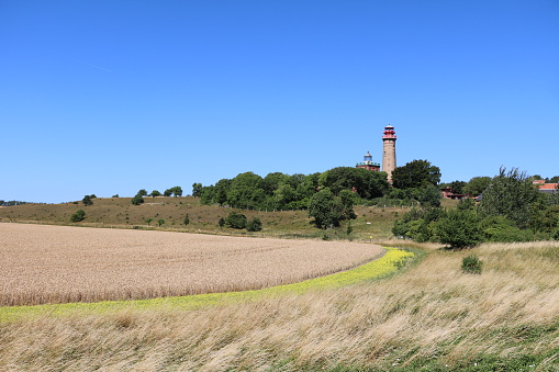 Rape field and New lighthouse at Cape Arkona on Island Rügen, Germany. Baltic Sea