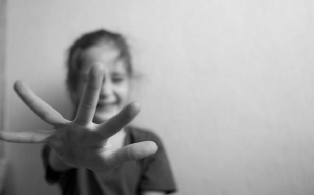 istock Little girl protects herself with an open palm 1090167232