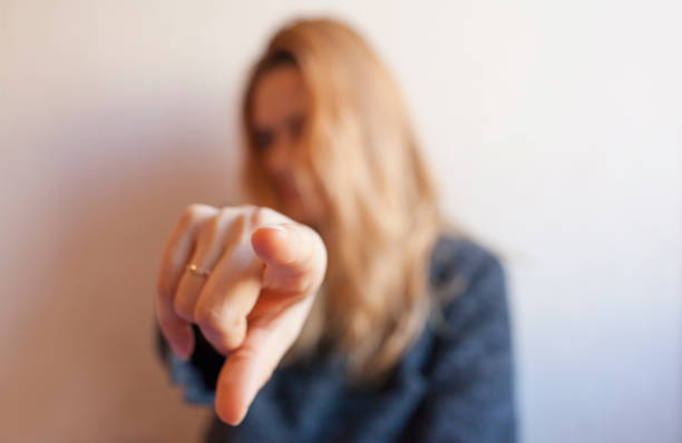 istock Young woman shows index finger 1090167462