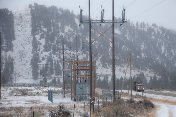 istock Power Lines, Truck, Mountain and Snow 1090169788