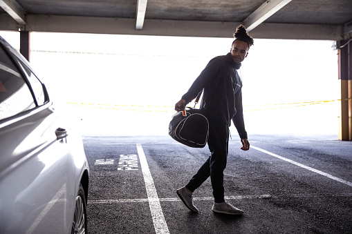 Young man going to the gym in the city