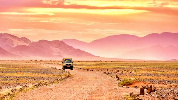 kulala desert lodge - africa sunset desert landscape stock-fotos und bilder