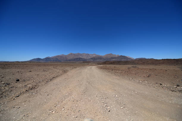 istock Dirt road leading to Brandberg Mountain, Namibia 1090199640