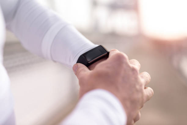 istock Sporty young man checking tracking pulse on a smart watch. 1090201320