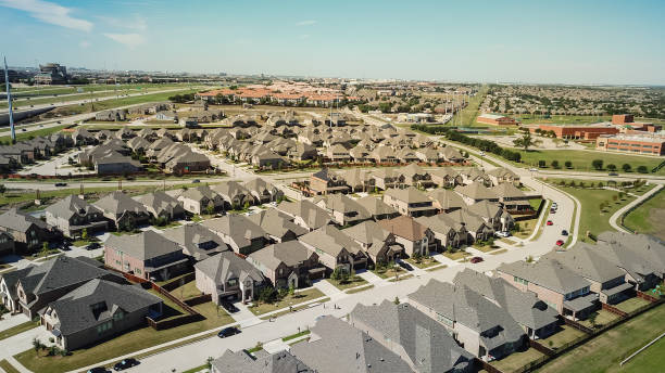 istock Top view new development area with residential houses, highway and school district 1090210298