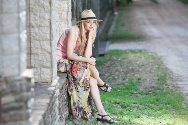 istock blonde woman nature summer, hat 1090213678