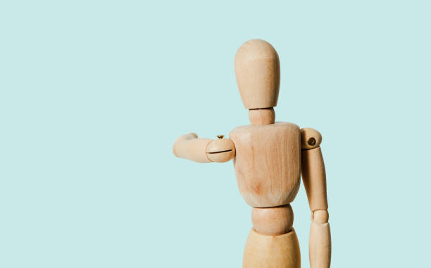 istock A wooden mannequin shows with his hand. 1090217018