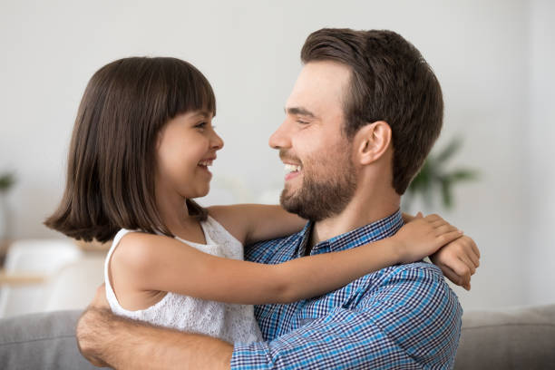 istock Cute kid girl laughing embracing father having fun with dad 1090217468
