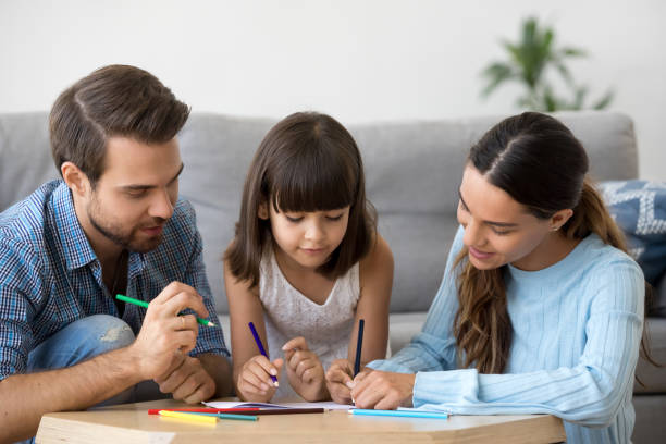 istock Creative family enjoy playing drawing with colored pencil on paper 1090217630