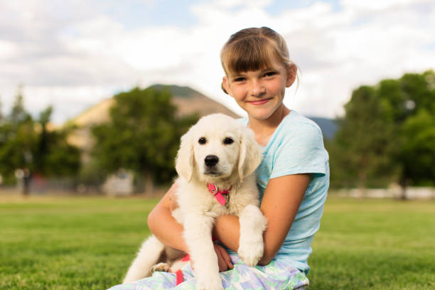 istock Young Girl with Puppy 1090223790