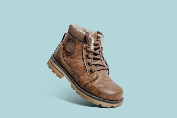 istock Leather, children's shoe on a pastel, blue background. 1090223906