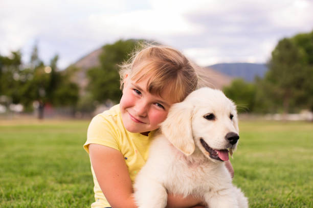 istock Young Girl with Puppy 1090224040