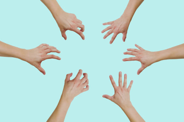 istock Top view of hands reaching for something isolated on a green 1090224548