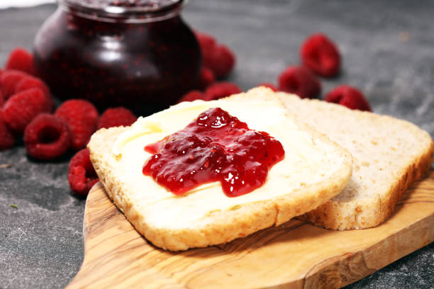 istock Toast bread with homemade raspberry jam or marmalade on rustic table served with butter for breakfast or brunch 1090231280