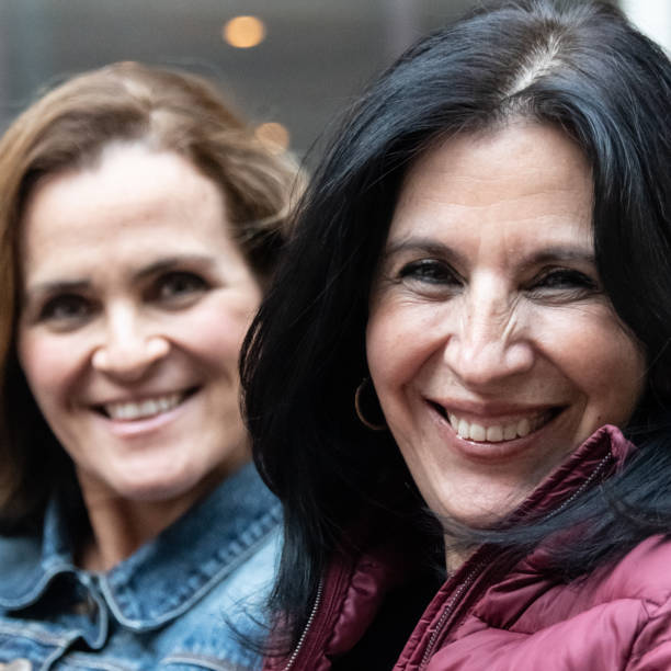 istock smiling mature women posing looking at the camera 1090237300